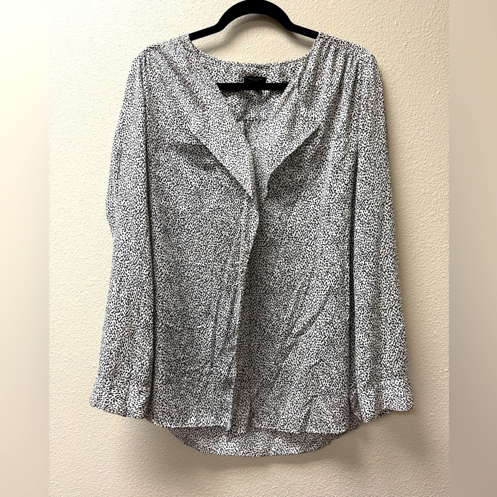 Ann Taylor long sleeved blouse. Black and white. Size 10 with stylish ruffles.